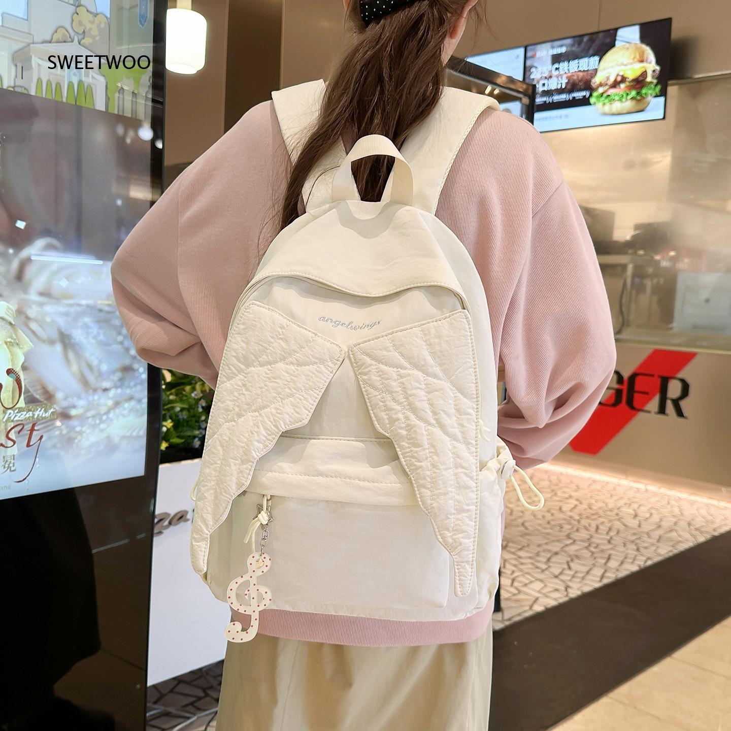 女性用ピンクエンジェルウィングリュックサック、キルト加工の翼 - Embroidery And Quilting のレビューと価格